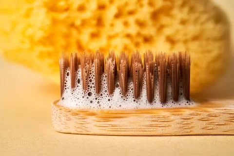 Toothbrush with toothpaste foam close-up. Stock Photos