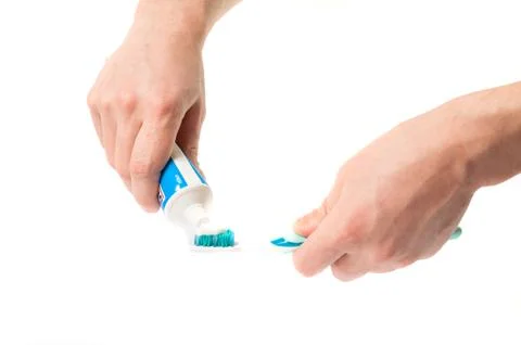 Toothbrush with toothpaste in the hand Stock Photos