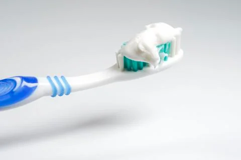 Toothbrush with toothpaste isolated Stock Photos
