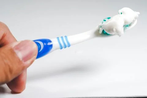 Toothbrush with toothpaste isolated Stock Photos