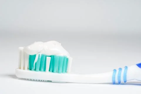 Toothbrush with toothpaste isolated Stock Photos