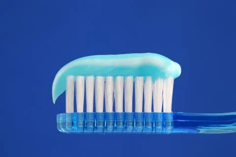 Toothbrush with toothpaste Stock Photos