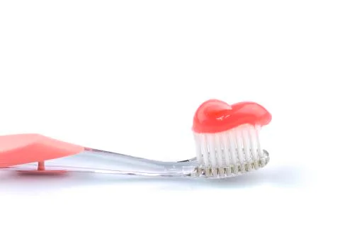 Toothbrush with toothpaste Stock Photos
