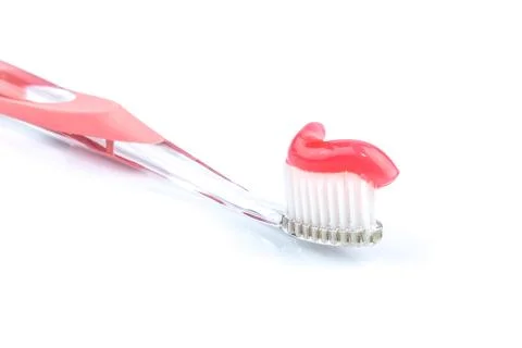 Toothbrush with toothpaste Stock Photos
