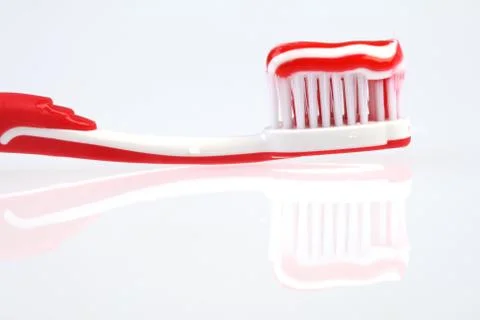 Toothbrush with toothpaste Stock Photos