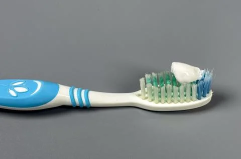 Toothbrush with toothpaste ready for brushing teeth at home Stock Photos
