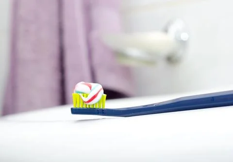 Toothbrush with toothpaste at the sink Stock Photos