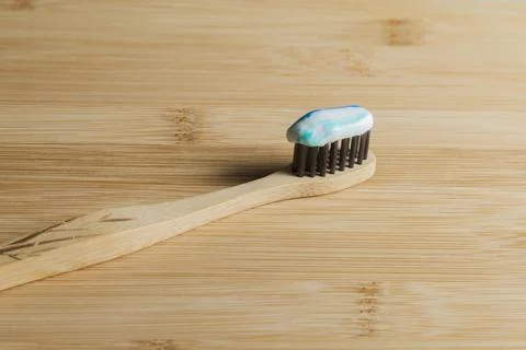Toothbrush with toothpaste on the table. Copy space and negative image space. Stock Photos