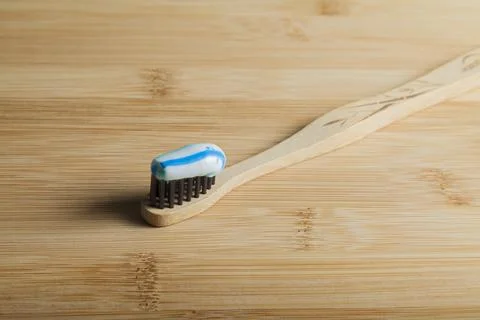 Toothbrush with toothpaste on the table. Copy space and negative image space. Stock Photos
