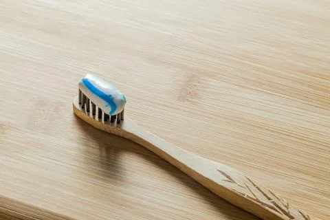 Toothbrush with toothpaste on the table. Copy space and negative image space. Stock Photos