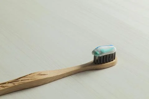 Toothbrush with toothpaste on the table. Copy space and negative image space. Stock Photos