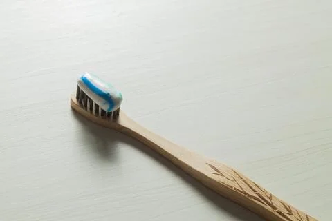 Toothbrush with toothpaste on the table. Copy space and negative image space. Stock Photos