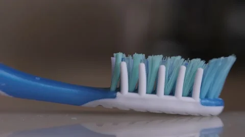 Toothbrush - Water Turns On - Macro Stock Footage 148442072