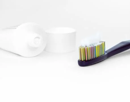 Toothbrush with white toothpaste on white background. 스톡 사진