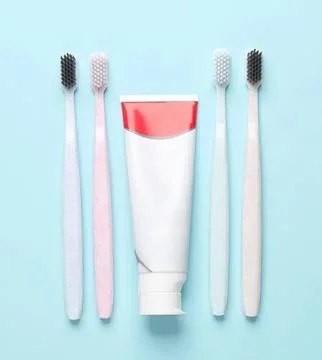 Toothbrushes and toothpaste on light blue background Fotos Stock