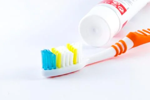 Toothbrushes and toothpaste on white background Stock Photos