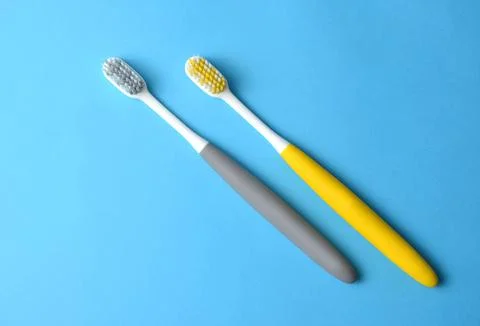 Toothbrushes on a blue background. Foto stock
