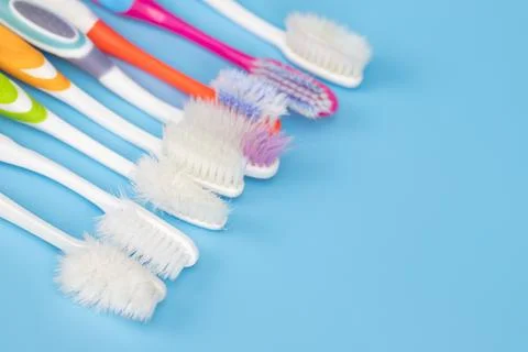 Toothbrushes on a blue background. zero waste concept. dental care without .. Stock Photos