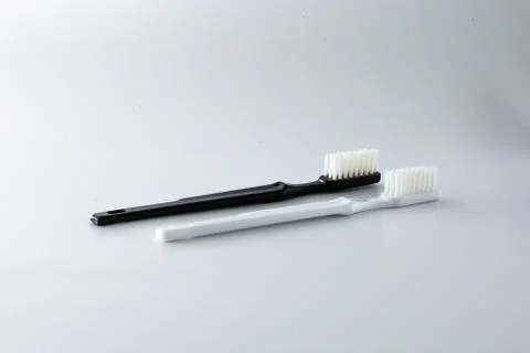 Toothbrushes of different colors Stock Photos