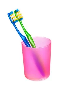 Toothbrushes in glass Stock Photos