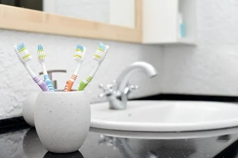 Toothbrushes in glass Stock Photos