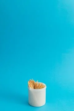 Toothbrushes in a jar on a blue background Foto stock