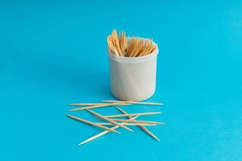 Toothbrushes in a jar on a blue background Stock Photos