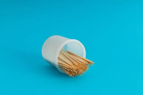 Toothbrushes in a jar on a blue background Stock Photos