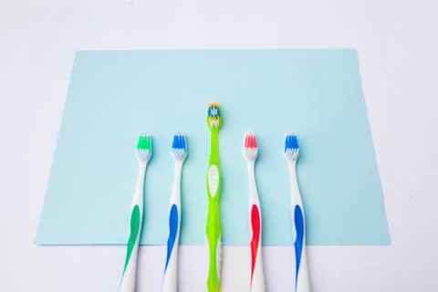 Toothbrushes on light blue background, close up different kinds of Toothbrush Stock Photos
