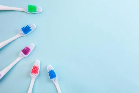 Toothbrushes on light blue background, close up different kinds of Toothbrush Stock Photos