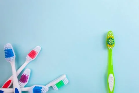 Toothbrushes on light blue background, close up different kinds of Toothbrush Stock Photos