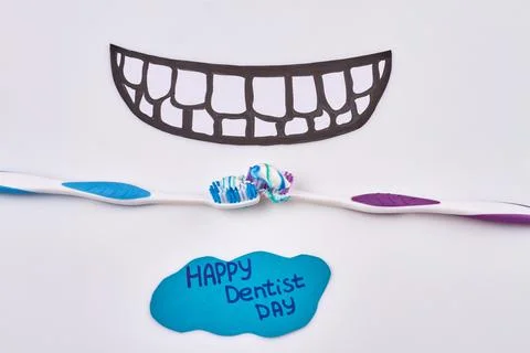Toothbrushes with toothpaste layer and drawning teeth illustration. 스톡 사진