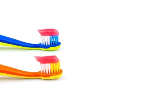 Toothbrushes with toothpaste Stock Photos