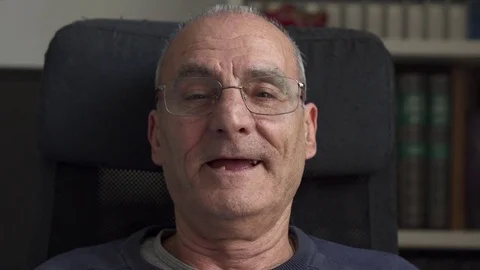 Toothless smile of an happy old man,close up Stock Footage