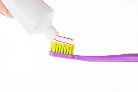 Toothpase on toothbrush Stock Photos