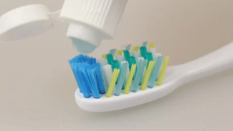 Toothpaste and toothbrush close up Stock Footage 117444286