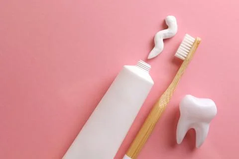 Toothpaste and toothbrush on a colored background. Dental care, oral health. Stock Photos