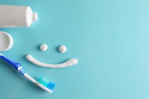 Toothpaste and toothbrush on a colored background. Dental care, oral health. Stock Photos