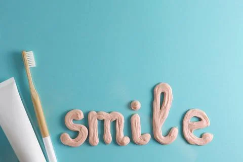 Toothpaste and toothbrush on a colored background. Dental care, oral health. Stock Photos