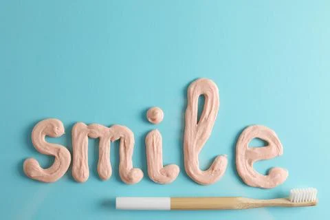 Toothpaste and toothbrush on a colored background. Dental care, oral health. Stock Photos