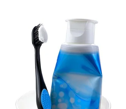 Toothpaste and toothbrush in the glass Stock Photos