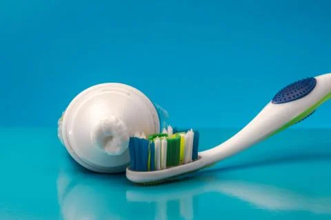 Toothpaste and toothbrush with reflection Stock Photos