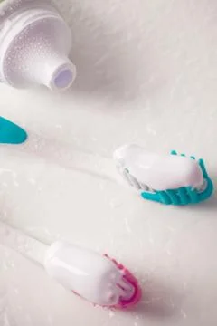 Toothpaste and toothbrushes Stock Photos