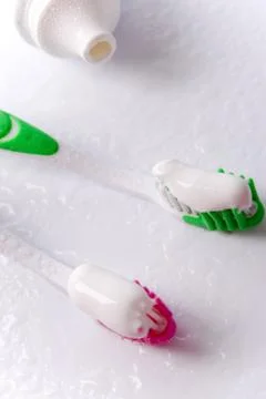 Toothpaste and toothbrushes Stock Photos