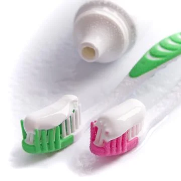 Toothpaste and toothbrushes Stock Photos