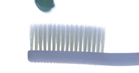 Toothpaste is applied to a toothbrush. Close up shot 스톡 동영상 139093229