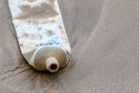 Toothpaste cover dumped into the ocean pollute Matara beach Stock Photos