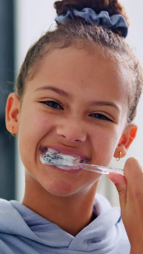 Toothpaste, dental care and face of child in bathroom for hygiene, wellness and Vídeos de archivo 335753681