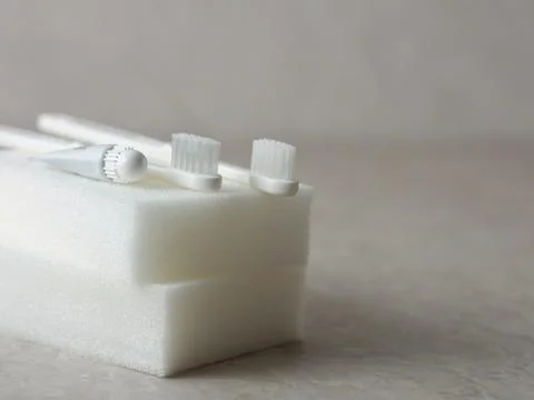 Toothpaste, toothbrush and various disposable items Stock Photos