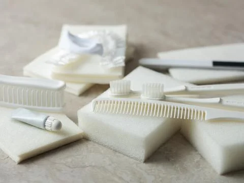 Toothpaste, toothbrush and various disposable items Stock Photos